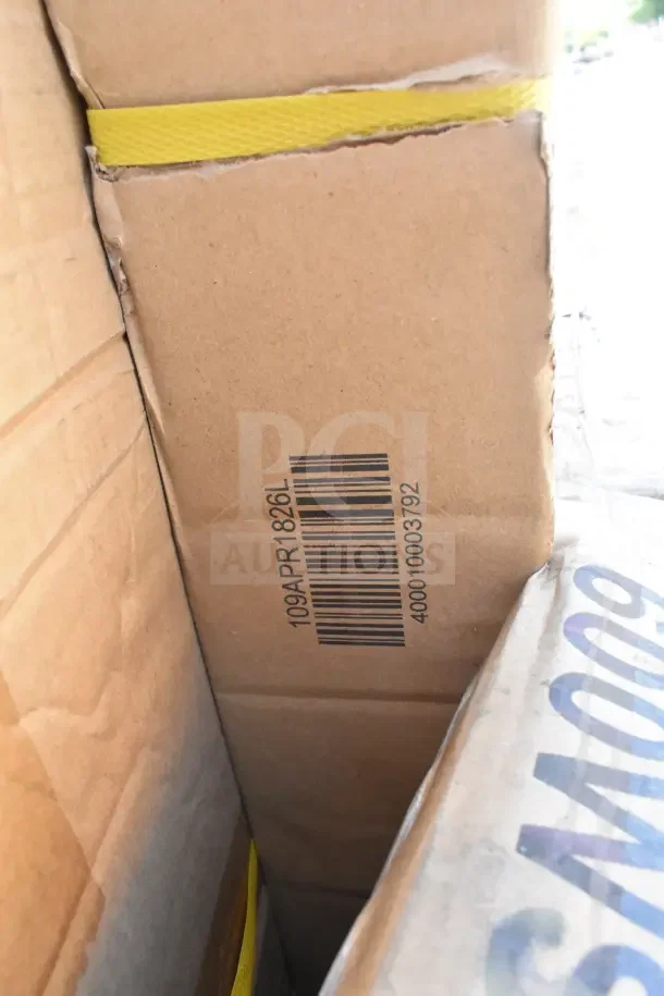 16 scratch and dent items in box, including wall shelf and pan rack. Barcode 40001003792 visible. Condition: brand new.