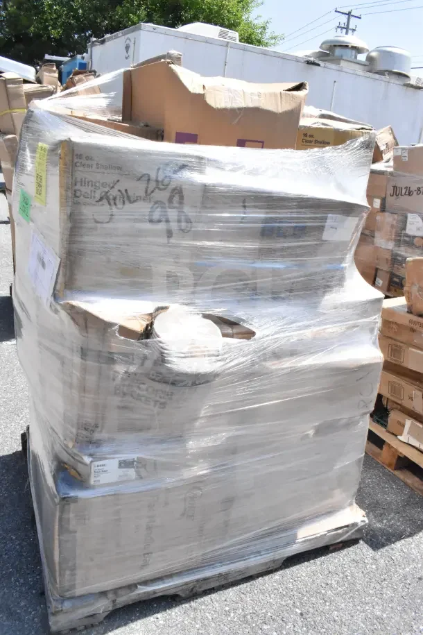 Pallet of 16 scratch and dent items, shrink-wrapped. Includes containers, juice bottles, baskets, and paper towels. Marked JUL26-98.