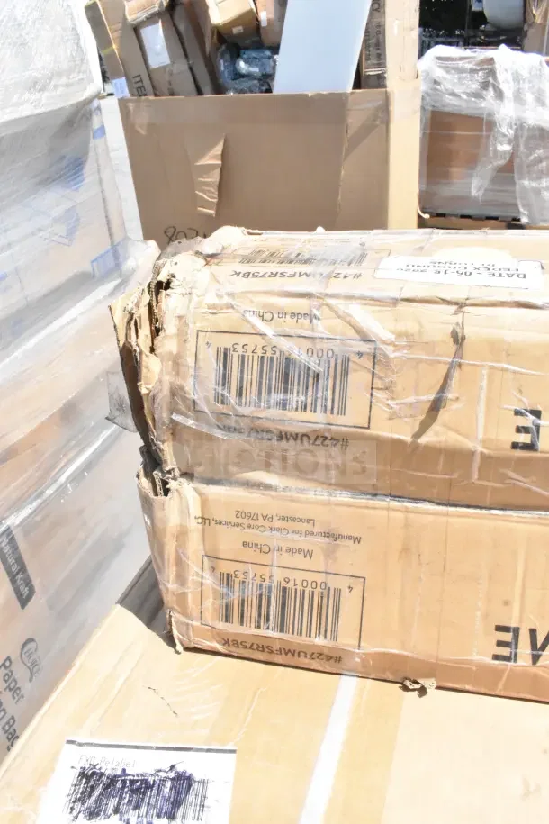 Damaged cardboard boxes containing 13 new scratch and dent items, including work and outdoor tables. Markings and barcodes visible.