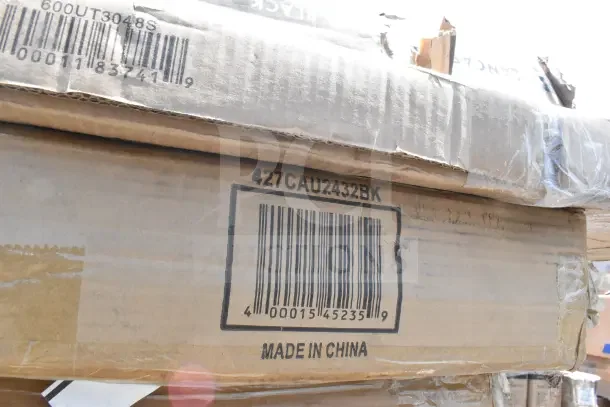 Cardboard boxes labeled "Made in China," containing 13 new scratch and dent items, including work and outdoor tables.