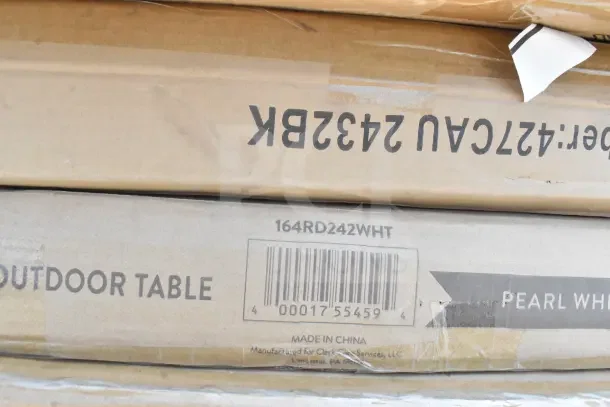 Cardboard boxes labeled "Outdoor Table," model 164RD242WHT, pearl white, new with minor damage.