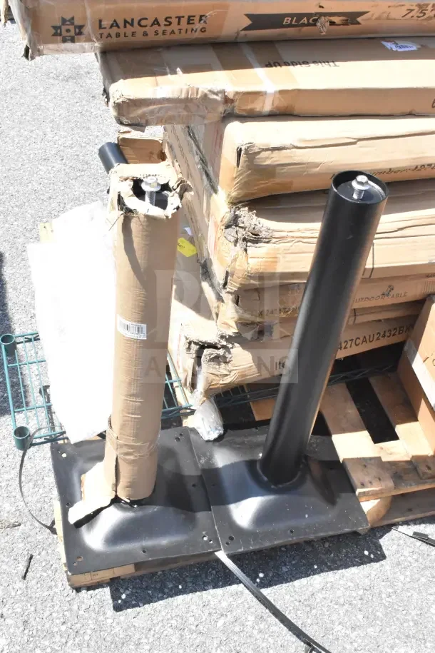 13 new scratch and dent items, including Lancaster work table and outdoor tables, in original packaging with visible wear.