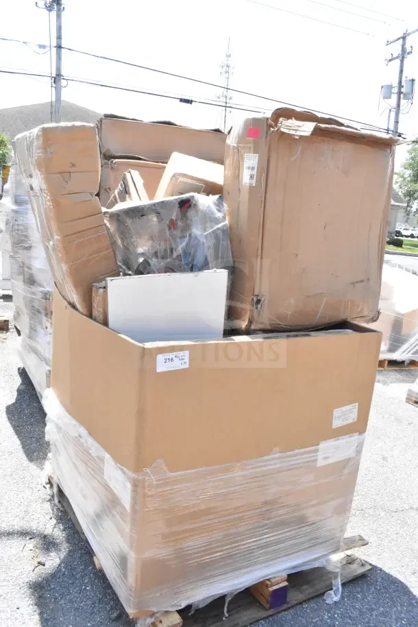 Large cardboard box containing 14 brand new scratch and dent items, including tabletop, sheet pan rack, and high chair.