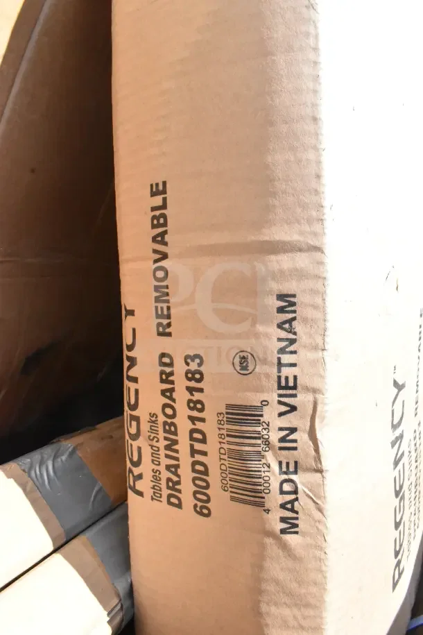 Cardboard box labeled "Regency Tables and Sinks," model 600DTD18183, made in Vietnam, showing drainboard removable feature.