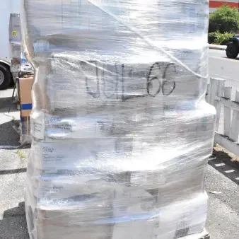Pallet of 24 brand new scratch and dent items wrapped in plastic, including food trays, plates, foam cups. Markings read "JUL-66".