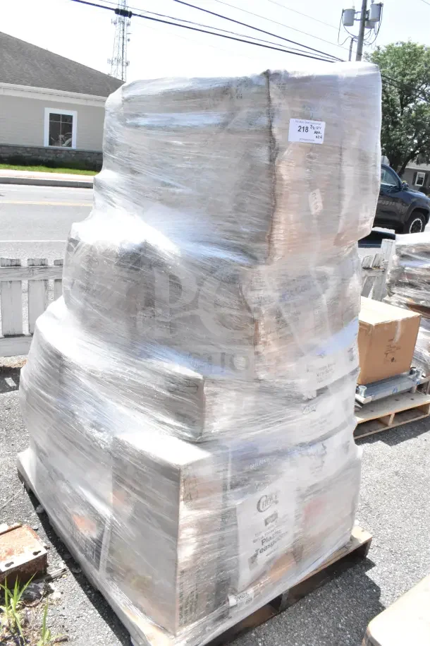 Plastic-wrapped pallet containing 24 scratch and dent items, including food trays, plates, foam cups, and hot cups. Tags visible.