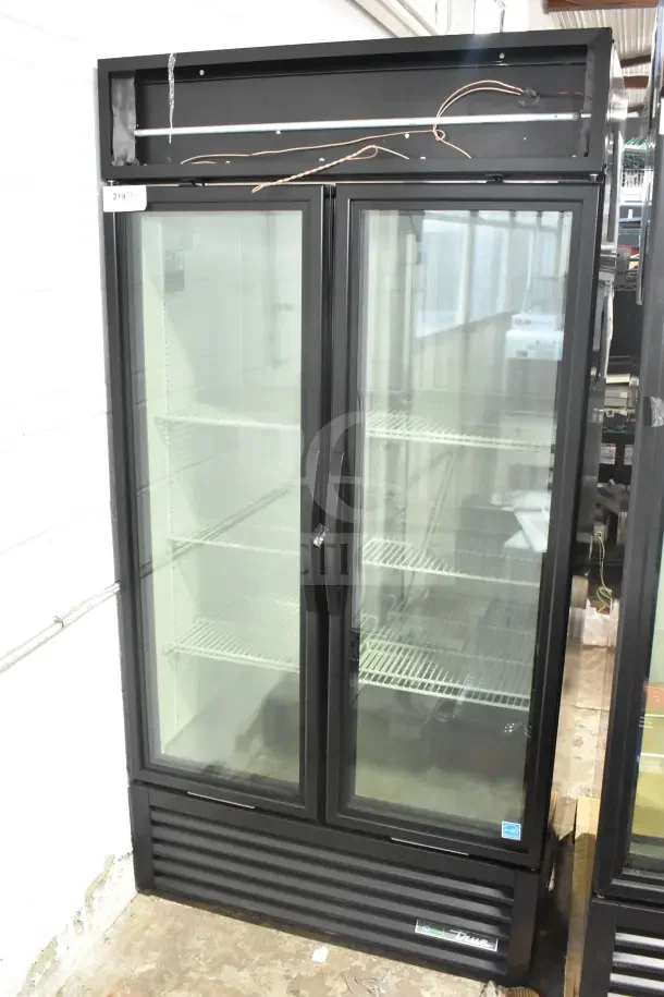 Brand new 2025 True GDM-35F-HC commercial 2-door reach-in freezer merchandiser with scratches and dents, 115 volts, 1 phase.
