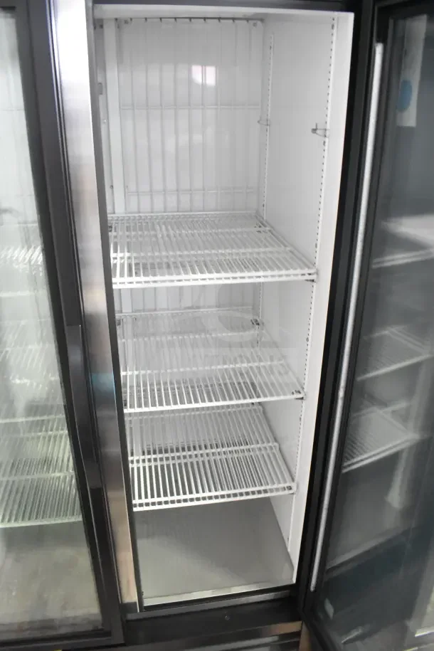 Brand new True GDM-35F-HC commercial 2-door freezer merchandiser, 115V, slight scratch and dent. Three wire shelves.