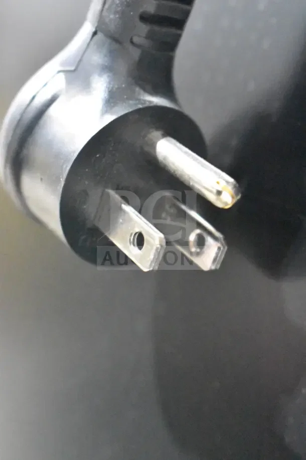 Close-up of a power plug for the 2025 True GDM-35F-HC commercial freezer merchandiser, 115 volts, 1 phase.