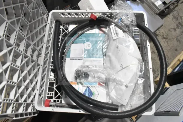 Brand new Noble 495LTUC24 undercounter dishwasher parts in packaging, includes hoses and manuals. Scratch and dent condition.