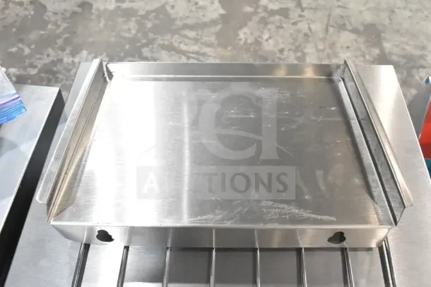 Brand new Avantco 184T140 conveyor toaster. Stainless steel, 10" wide, 3” opening. Minor scratches visible.