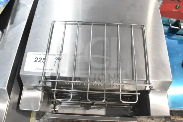 Brand new Avantco 184T140 conveyor toaster, 10" wide, 3" opening, stainless steel, scratch and dent condition. Tag visible.