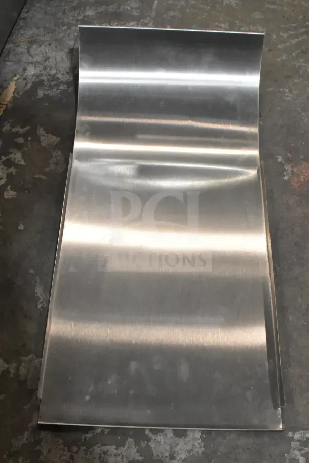Silver metal conveyor part for Avantco 184T140 toaster. New condition with visible scratches. Flat, smooth surface.