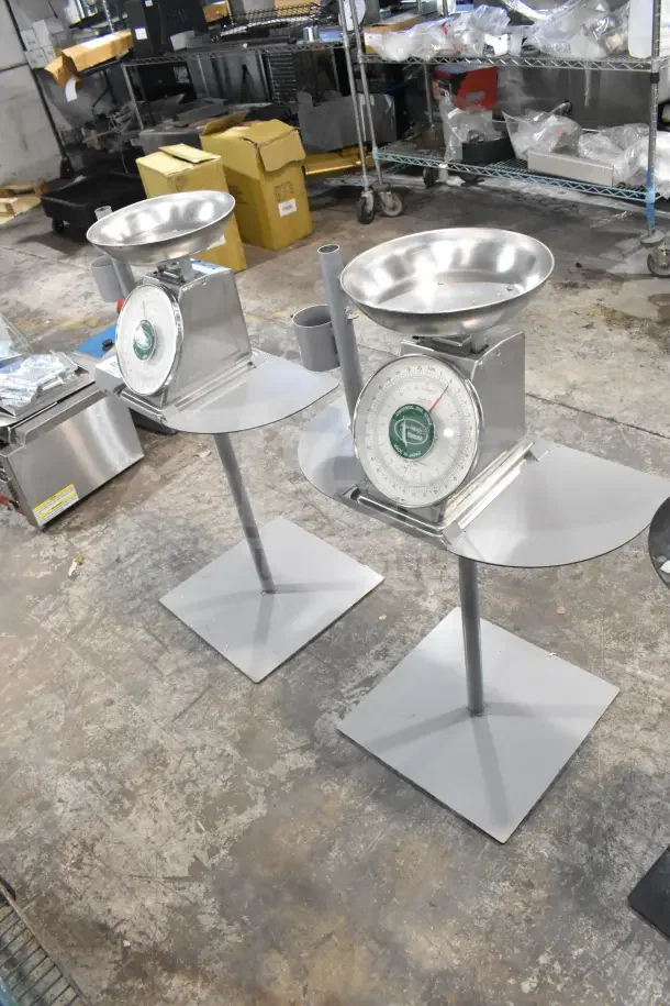 Two Yamato Accu-Weigh SM(N) Universal Dial Scales on stands, aluminum finish, round dial displays, excellent condition.