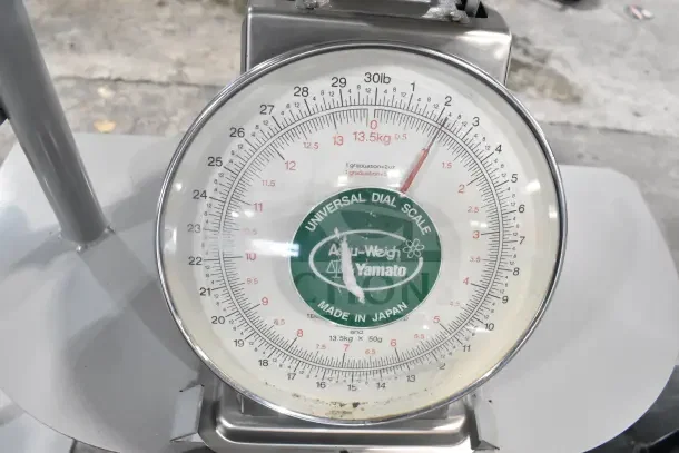 2 Yamato Accu-Weigh SM(N) Universal Dial Scales on stands, made in Japan, marked with 30lb/13.5kg capacity, durable condition.