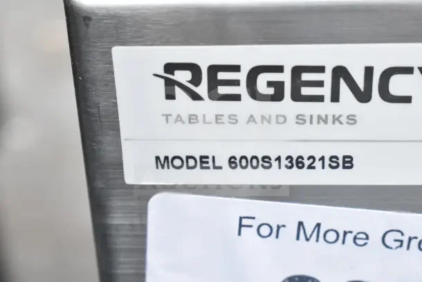 "Regency 600S13621SB tag on a brand new commercial utility sink, 36x21x13 inch bowl, scratch and dent condition."