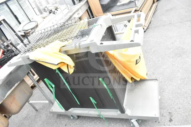 2 brand new Lavex Janitorial carts, scratch and dent condition, with yellow bags and metal frame, on wheels.