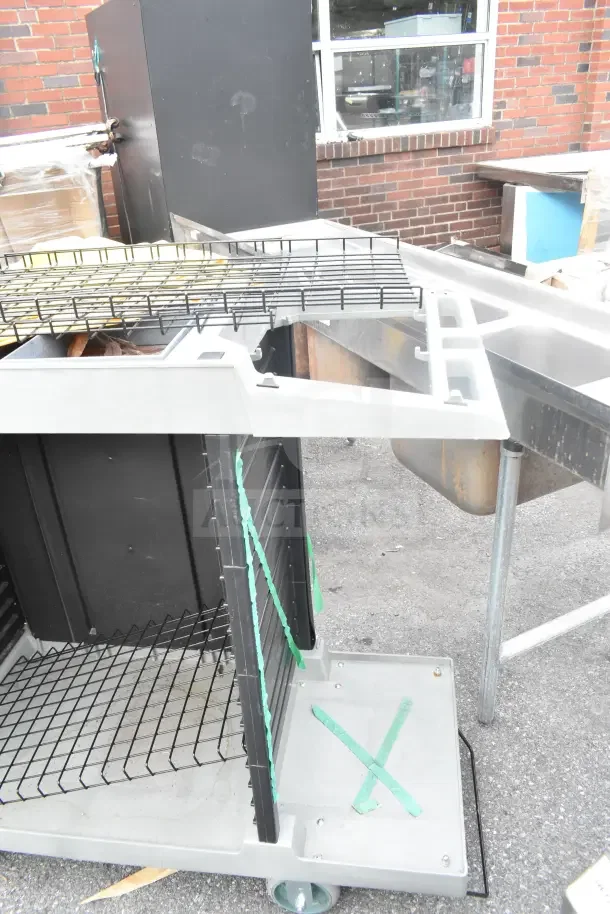 Two Lavex janitorial carts, brand new with minor scratches and dents, shown with wire shelves and sturdy wheels.