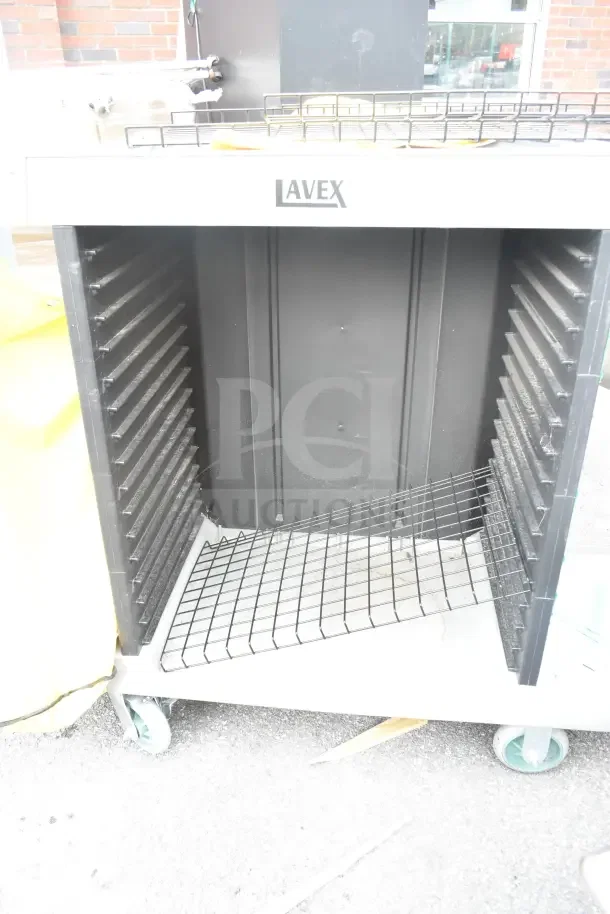Brand new Lavex janitorial cart with minor dents. Features durable construction, wire shelves, and wheels for mobility.