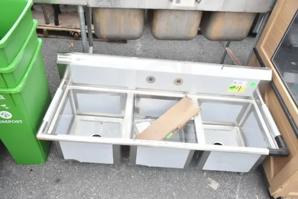 Regency 60" three-compartment commercial sink, galvanized steel legs, brand new with visible scratches, model 600S31717.