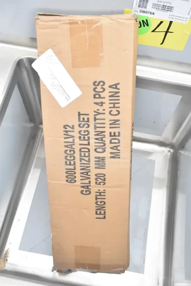 Brand new Regency 600S31717 60" three compartment commercial sink with galvanized steel legs, scratch and dent condition. Labels indicate galvanized leg set, 4 pieces, made in China.