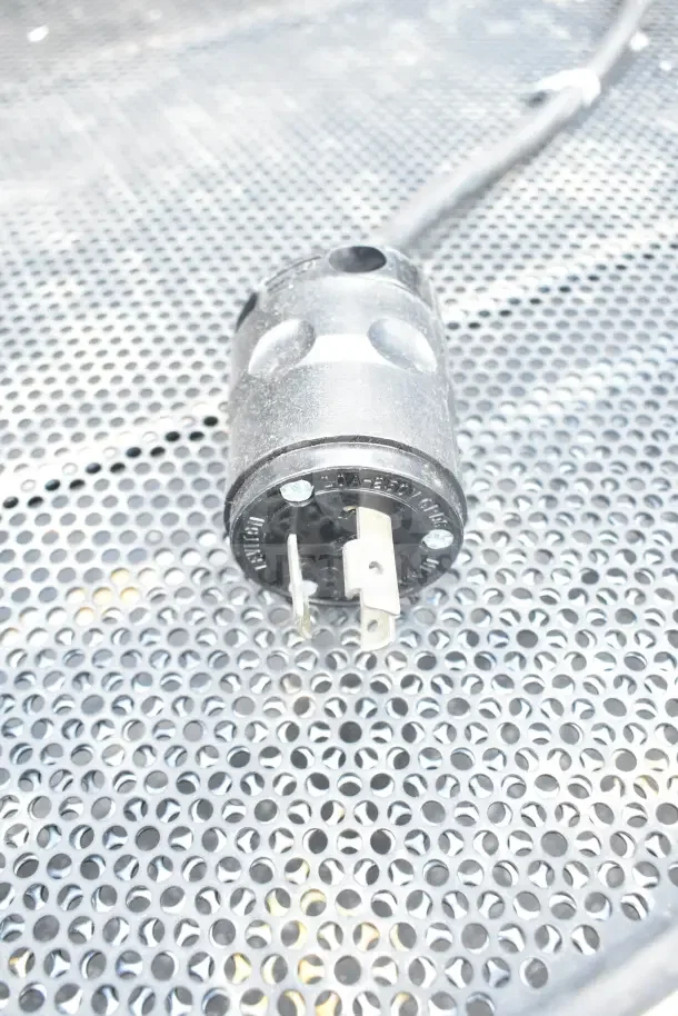 Killion Commercial Grab N Go Merchandiser plug on perforated metal surface, 120/208-240V.
