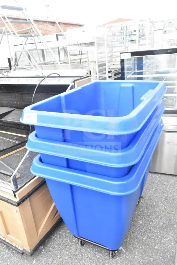 3 Lavex blue poly tilt trucks on commercial casters, new condition, visible tag "237", minor scratches/dents.