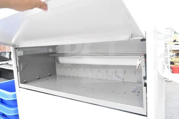 Brand new Hirsh HL10000 Series five-drawer white file cabinet, 42"x18 5/8"x67 5/8", with binder storage, keys visible.
