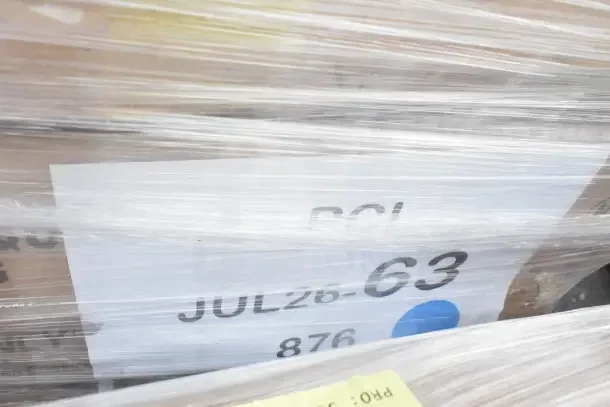 Package with 19 scratch and dent items, including a work table and sink, wrapped in plastic. Label shows "JUL26-63."
