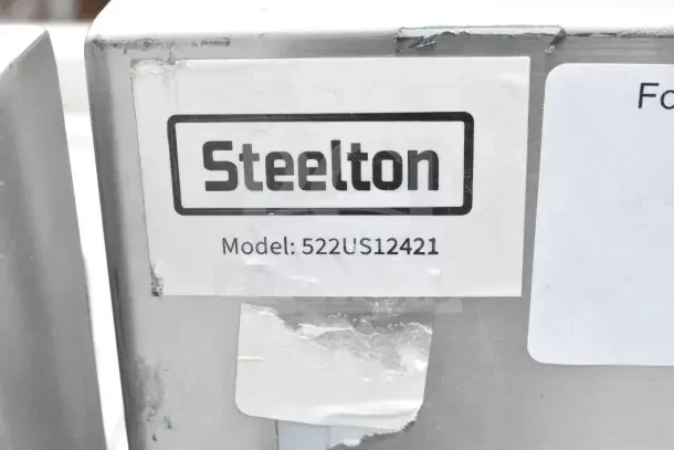 Steelton 522US12421 utility sink, 24"x21"x14", scratch and dent condition. Steel surface with visible label.