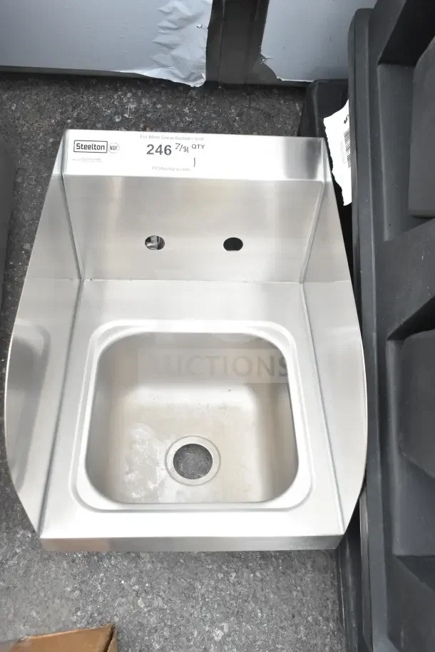 Steelton 522HS1216S wall-mount hand sink, 12" x 16", brand new with side splashes, slight scratches visible.