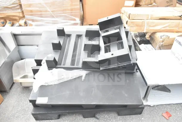 6 brand new scratch and dent plastic display base pallets stacked, industrial setting.