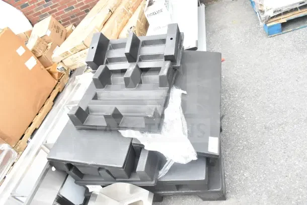 Six brand-new plastic display base pallets with minor dents, stacked. Ideal for retail, durable construction.