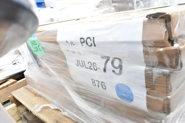 Packaged items labeled JUL26-79, four brand new scratch and dent tabletop and base sets wrapped in plastic on pallets.