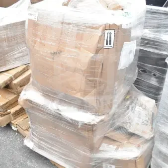 Pallet wrapped with cardboard boxes labeled "254," containing scratch and dent items including a pan rack and sink.