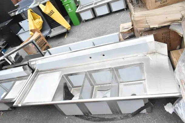 BRAND NEW Regency 600DDTS384LFT 7' soiled dish table with 3-compartment sink, left drainboard, no legs, 16-gauge stainless steel.