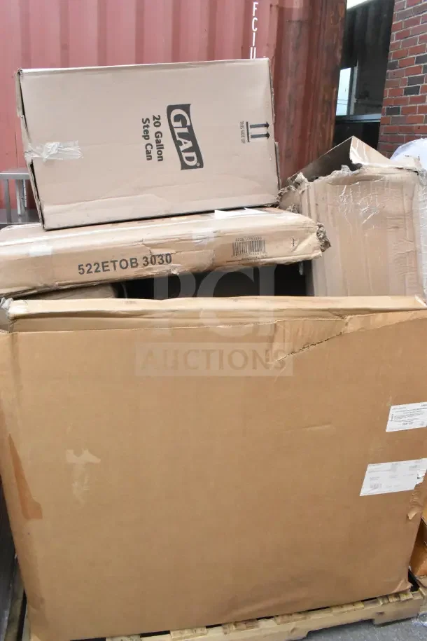 Boxes containing 14 brand new scratch and dent items, including plates, Dutch oven, and towel. Visible "Glad" label on box.