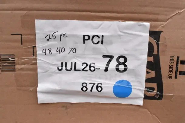 Cardboard box with label stating "PCI JUL26-78 876" and handwritten "25 pc 48 40 70." Contains new scratch and dent items.