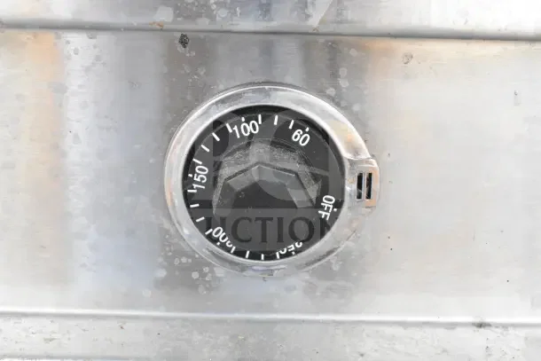 Dial on a stainless steel steam table showing temperature settings from 60 to 150 degrees Fahrenheit and off position.