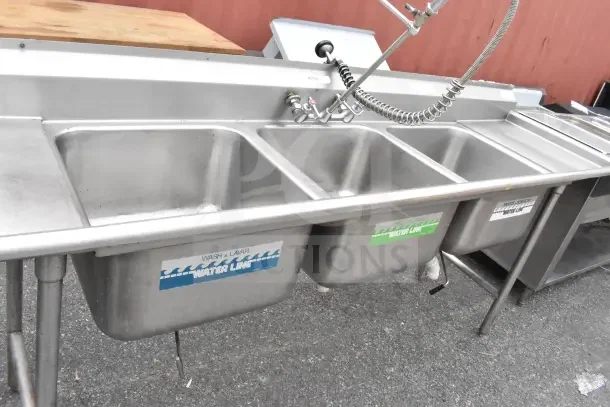 Advance Tabco commercial 3 bay sink with dual drain boards, stainless steel, labeled "Water Line," features pre-rinse faucet.
