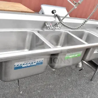 Advance Tabco commercial 3 bay sink with dual drain boards, stainless steel, labeled "Water Line," features pre-rinse faucet.