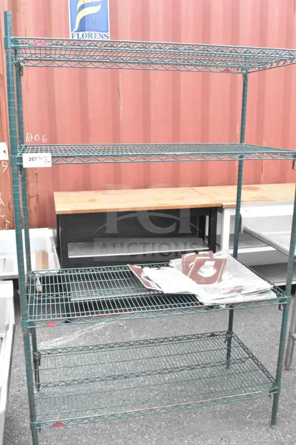 Green finish 4-tier wire shelving unit, ideal for storage. Buyers must dismantle; note potential freight charges.