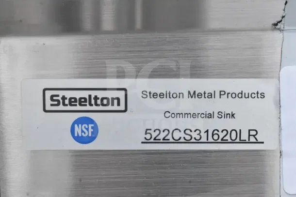 Alt text: Steelton 522CS31620LR label on commercial 3 bay sink with dual drain boards, new scratch and dent condition.