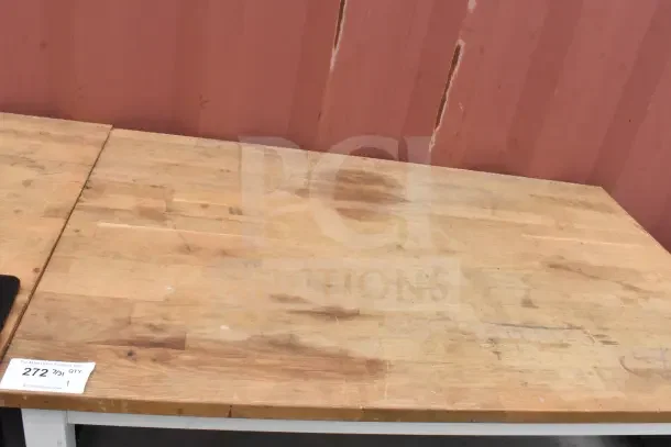 Wood pattern countertop with two-tier under shelf, showing wear marks. Auction tag visible, labeled "272."