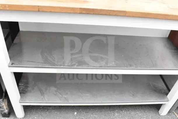 Wood pattern countertop with two-tier under shelf, metal frame. Distressed surface, suitable for storage or work space.