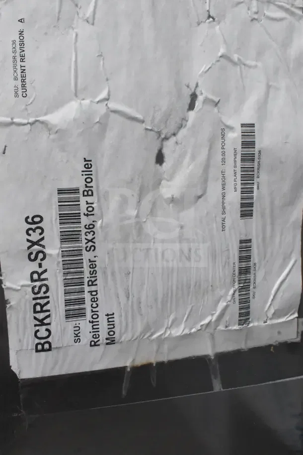 Alt text: Vulcan BCKRISR-SX36 36" high shelf, new with visible packaging damage, reinforced riser for broiler mount, SKU label shown.