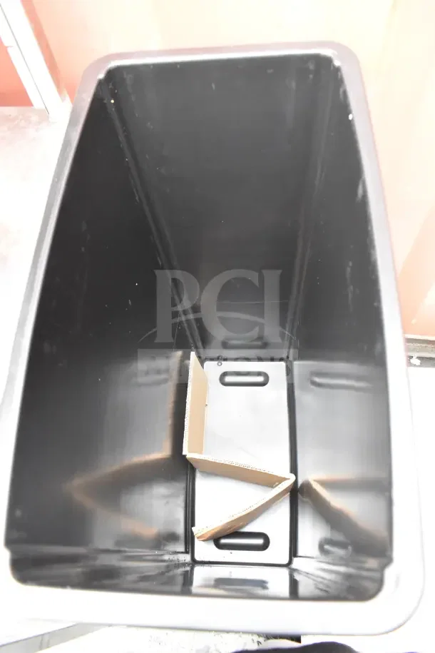 Lavex Slim Jim black poly trash can, brand new, minor scratches, sturdy design, cardboard packing inside.