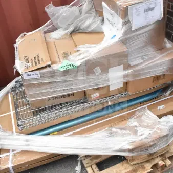 Stack of 10 brand new scratch and dent items, including wire shelf and pitcher, on a wrapped pallet. Boxes show labels and model info.