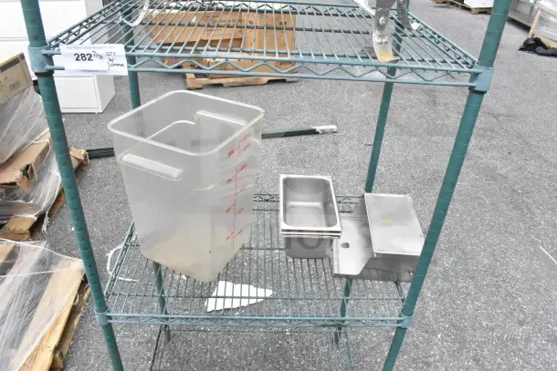 Green finish 4 tier wire shelving unit with various containers; buyer must dismantle; consider freight charges.