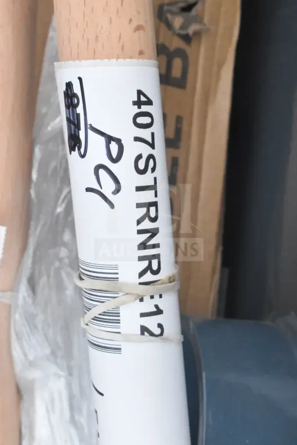Label on auction item showing model number "407STRNR-12" with handwritten note "PC1" indicating item details.